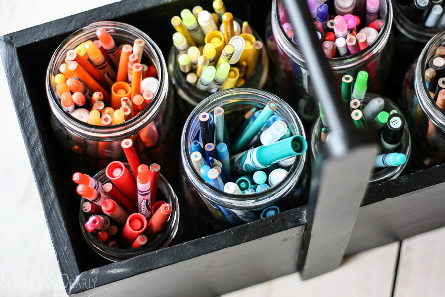 collection of colorful crayons inside jar