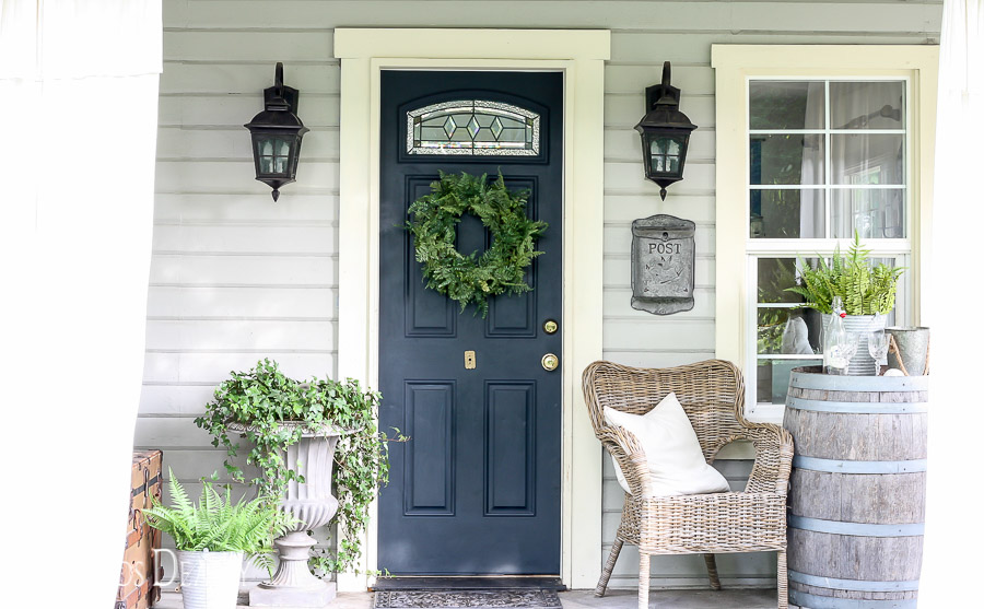 Faux fern wreath on navy blue front door