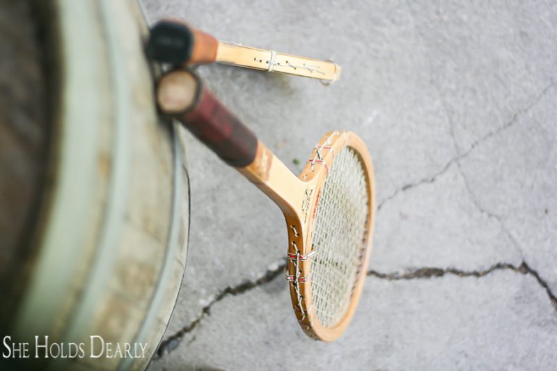 Vintage tennis rackets as porch decor for old farmhouse by sheholdsdearly.com
