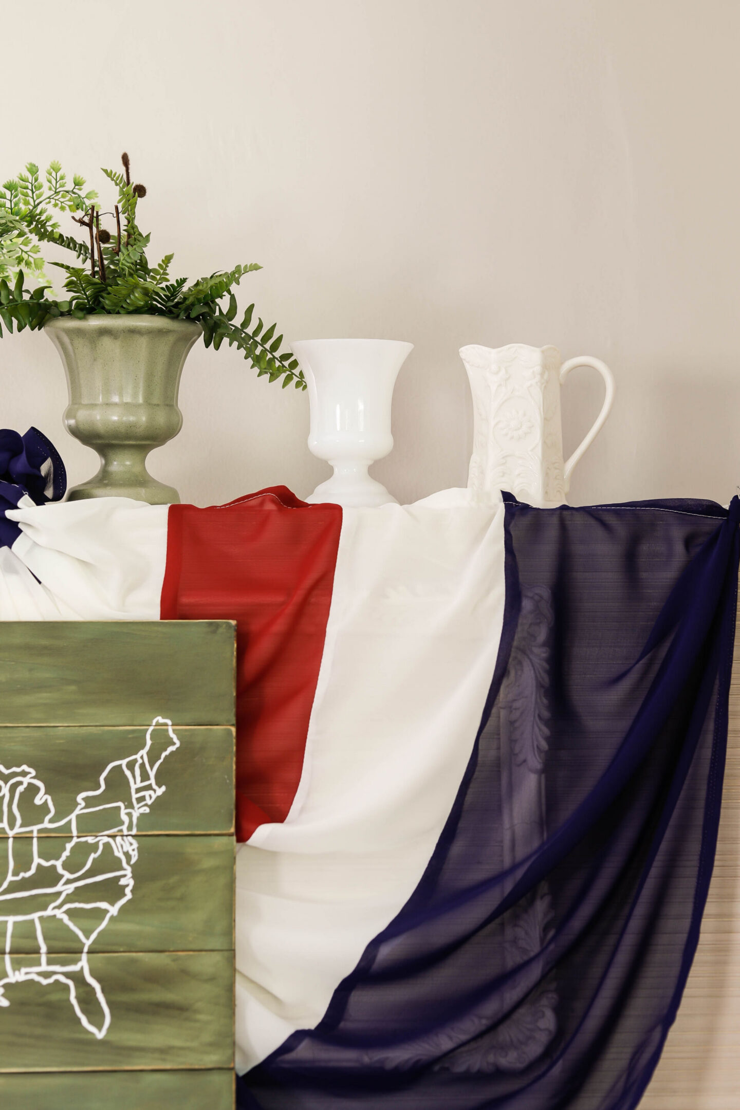 I fell in love with a beautiful, vintage patriotic bunting - but the $250 price-tag was a bit out of my price range. So instead, I made a DIY version for less than $40! This is a simple low-sew tutorial, great for even a beginner!